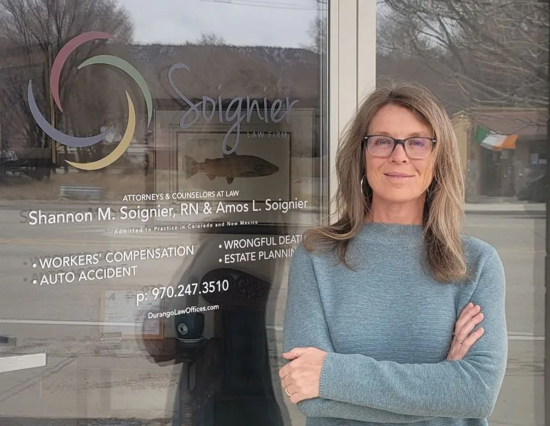 Shannon Soignier meeting with a client at the Soignier Law Firm in Durango
